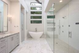 soaking tub and glass shower