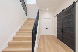 custom iron railing white oak wood stairs