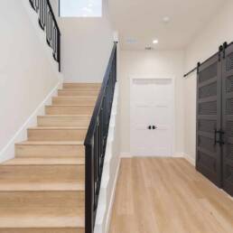 custom iron railing white oak wood stairs